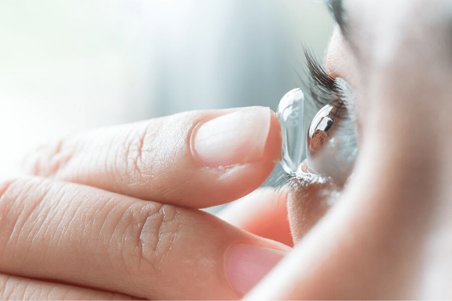 Inserting contact lens into eye